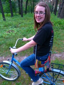Hannah on her bike in the woods